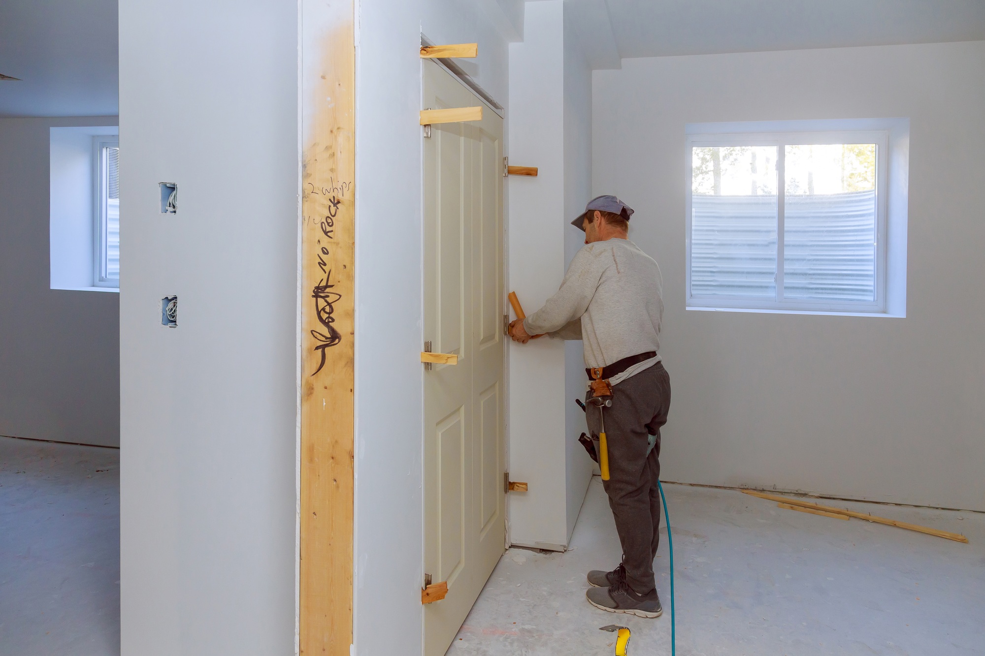 Handyman install the new twin door in the room